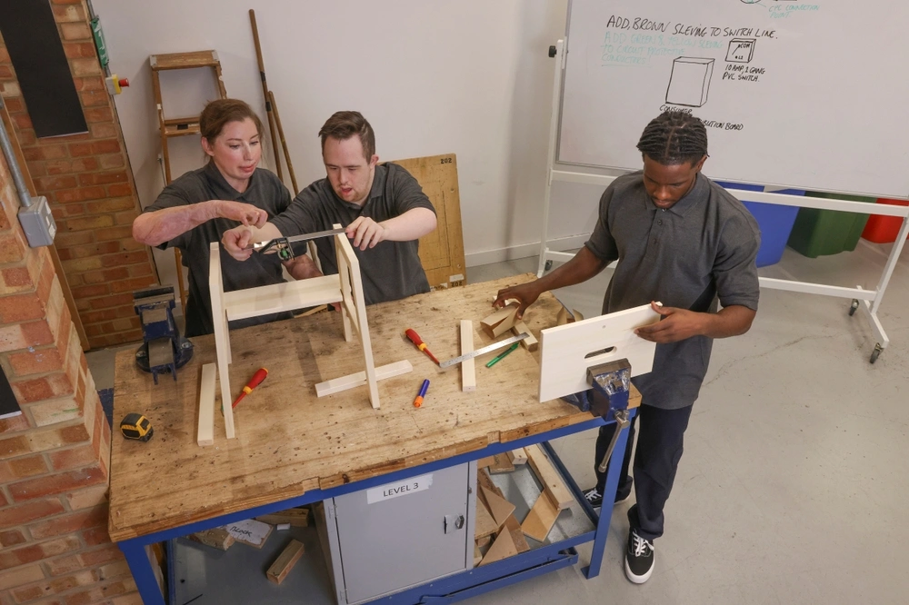 Diverse friends in carpentry class