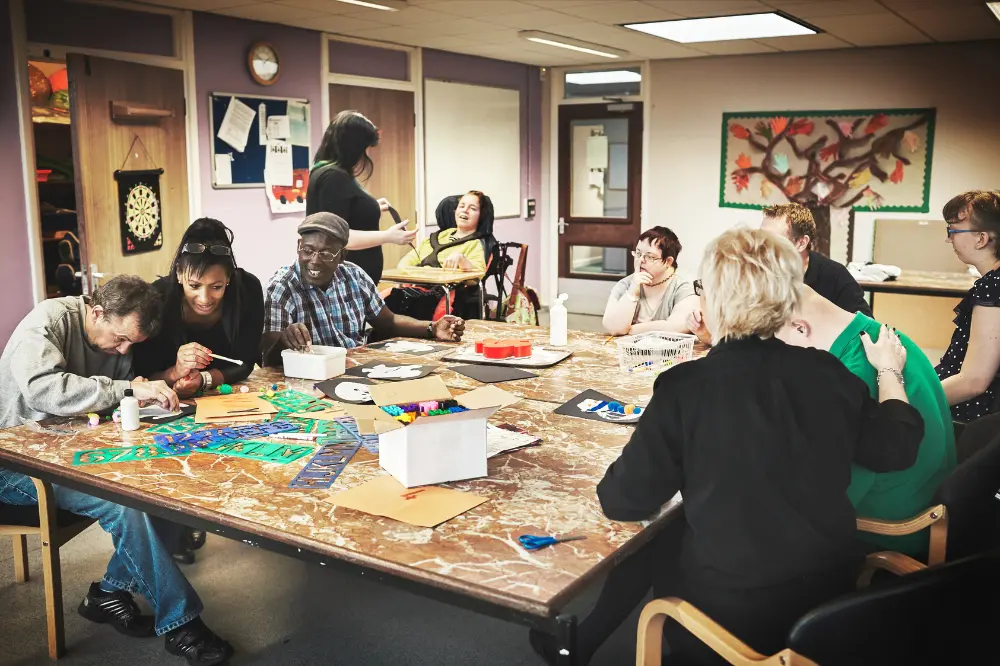 Diverse and disabled people doing activity at centre