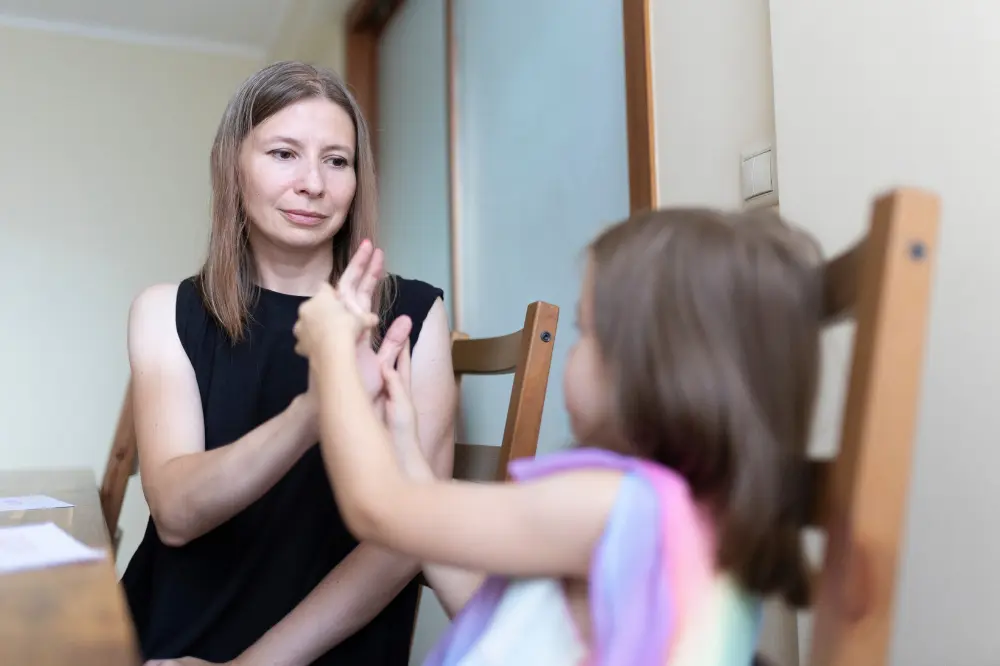 Support worker talking with disabled girl