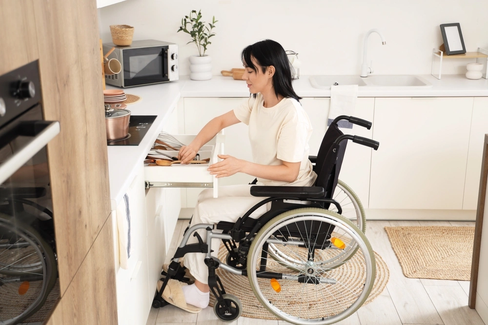 Disabled woman in kitchen