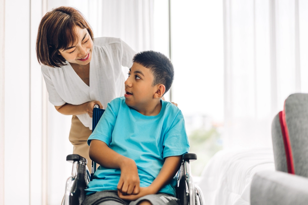 Nurse with disabled man in wheelchair